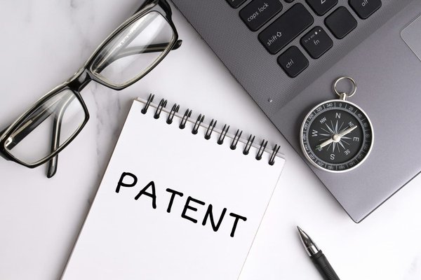 What is the procedure for filing a patent for a new invention in the UK?